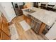 Spacious kitchen island featuring a stainless steel sink, granite countertops, and modern cabinetry, creating a functional workspace at 9953 Fletcher Peak Ave, Las Vegas, NV 89178