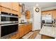 Well-equipped kitchen with stainless steel appliances, granite countertops, a gas cooktop, and ample cabinet space for storage at 9953 Fletcher Peak Ave, Las Vegas, NV 89178