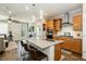 Beautiful kitchen featuring granite countertops, stainless steel appliances and stylish pendant lighting at 9953 Fletcher Peak Ave, Las Vegas, NV 89178