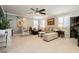 Inviting living room with neutral carpet, ceiling fan, and plantation shutters at 9953 Fletcher Peak Ave, Las Vegas, NV 89178