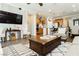 Cozy living room with view of kitchen and dining area. Perfect for relaxing and entertaining guests at 9953 Fletcher Peak Ave, Las Vegas, NV 89178