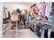 Organized walk-in closet featuring shelving, hanging rods, and ample storage space for clothes and accessories at 9953 Fletcher Peak Ave, Las Vegas, NV 89178