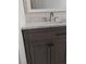 Modern bathroom vanity with gray wood cabinets, stylish hardware, white marble countertop, and a framed mirror at , North Las Vegas, NV 89030