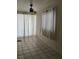 Bright bonus room featuring tile flooring, white block walls, large windows, and a ceiling fan at , North Las Vegas, NV 89030