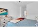 Bright bedroom with a dresser and large window, with neutral color scheme and comfy textiles at , North Las Vegas, NV 89031