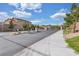 Community entrance with a gate, landscaping, and paved road leading into the neighborhood at , North Las Vegas, NV 89031