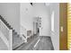 Bright entryway with high ceilings, gray floors, and a staircase leading to the upper level at , North Las Vegas, NV 89031