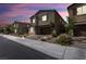 Charming two-story home with a two-car garage during dusk in a well-maintained neighborhood at , North Las Vegas, NV 89031