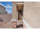 Inviting front porch featuring stone accents, a decorative wreath, and a tiled walkway at , North Las Vegas, NV 89031