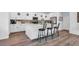 Bright kitchen featuring white cabinets, stainless steel appliances, a large island, and barstool seating at , North Las Vegas, NV 89031