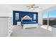 Bedroom features a striking blue accent wall, plush carpeting, and a sliding glass door to a balcony at , North Las Vegas, NV 89031