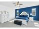 Bedroom featuring blue accent wall, plush carpeting, ceiling fan, and sliding door to a balcony at , North Las Vegas, NV 89031