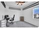 Bright office space with a modern desk, chair, storage, and natural light at , North Las Vegas, NV 89031