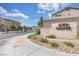 Community entrance sign for Aden Square with stone accents, landscaping, and a sidewalk at , North Las Vegas, NV 89031