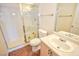 Bathroom featuring a glass shower, a toilet, and a single sink with wooden cabinets at 1000 Grammy Dr, Las Vegas, NV 89145