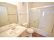 Bathroom featuring a glass shower, a toilet, and a single sink with wooden cabinets at 1000 Grammy Dr, Las Vegas, NV 89145