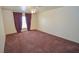 Spacious bedroom featuring carpet flooring, a ceiling fan, and a comfortable layout at 1000 Grammy Dr, Las Vegas, NV 89145
