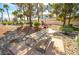 Community park featuring mature trees, a picnic table, and BBQ grill at 1000 Grammy Dr, Las Vegas, NV 89145