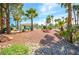 Community park featuring mature trees, green grass, and walking path at 1000 Grammy Dr, Las Vegas, NV 89145