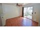 Bright dining area with hardwood floors and sliding glass door leading to the backyard at 1000 Grammy Dr, Las Vegas, NV 89145