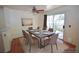 Staged dining area with modern table, chairs, setting, and a sliding glass door leading to the outdoors at 1000 Grammy Dr, Las Vegas, NV 89145