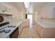 Spacious kitchen offering tile floors, lots of storage, and easy access to both appliances and adjacent living area at 1000 Grammy Dr, Las Vegas, NV 89145