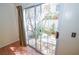 Bright view through sliding glass doors provides access to the lush outdoor patio at 1000 Grammy Dr, Las Vegas, NV 89145