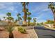Stone Canyon Northwest community signage featuring palm trees, desert landscaping and a secure gated entrance at 1000 Grammy Dr, Las Vegas, NV 89145