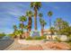 Stone Canyon Northwest community signage entrance featuring tropical landscaping and secure entrance at 1000 Grammy Dr, Las Vegas, NV 89145
