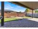 Backyard featuring an outdoor kitchen area, a manicured lawn, and ample seating at 1024 Fishing St, Henderson, NV 89011