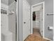 Bathroom featuring tiled shower with seating, an open door to walk-in closet and a towel rack at 1024 Fishing St, Henderson, NV 89011