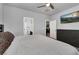 Comfortable bedroom with neutral walls, a ceiling fan, access to an en-suite bathroom, and a TV at 1024 Fishing St, Henderson, NV 89011