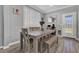 Bright dining area with natural light, wood-look floors, and a modern table and bench set at 1024 Fishing St, Henderson, NV 89011