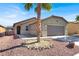 Lovely single-story home featuring desert landscaping, a two-car garage and a cozy entryway at 1024 Fishing St, Henderson, NV 89011
