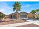 Charming single-story home with a two-car garage, desert landscaping, and a welcoming curb appeal at 1024 Fishing St, Henderson, NV 89011