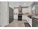 Modern kitchen with stainless steel appliances, sleek white cabinets, and stylish backsplash at 1024 Fishing St, Henderson, NV 89011