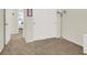 Bedroom featuring carpeted floors and ample closet space, perfect for storage at 10324 Lettuce Leaf St, Las Vegas, NV 89183