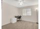 Bedroom featuring a desk, neutral walls, and a large window for natural light at 10324 Lettuce Leaf St, Las Vegas, NV 89183