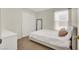 Bedroom with neutral walls, a full bed, a mirror, and ample natural light at 10324 Lettuce Leaf St, Las Vegas, NV 89183