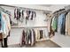 Walk-in closet featuring ample storage with hanging rods and shelves for organization at 10324 Lettuce Leaf St, Las Vegas, NV 89183