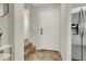 Entryway featuring tile flooring, stainless steel fridge, and access to other rooms at 10324 Lettuce Leaf St, Las Vegas, NV 89183