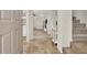 Inviting foyer with tile flooring, staircase, and view into the living area at 10324 Lettuce Leaf St, Las Vegas, NV 89183