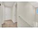 Hallway with neutral walls, carpet, and a white door leading to other rooms in the home at 10324 Lettuce Leaf St, Las Vegas, NV 89183