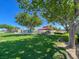 Community park featuring mature trees, grassy areas, picnic pavilions, and playground equipment at 10324 Lettuce Leaf St, Las Vegas, NV 89183