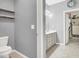Bathroom featuring a toilet, sink and vanity, with a walk-in closet at 10385 Kern Ridge St, Las Vegas, NV 89178
