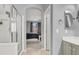 Modern bathroom with shower and vanity, seamlessly connecting to the bedroom for comfort at 10385 Kern Ridge St, Las Vegas, NV 89178