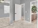 Comfortable bedroom with a ceiling fan and convenient access to an ensuite bathroom through a doorway at 10385 Kern Ridge St, Las Vegas, NV 89178