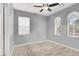 Cozy bedroom with neutral carpet, natural light, and simple window coverings, providing a relaxing and comfortable space at 10385 Kern Ridge St, Las Vegas, NV 89178