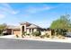 Charming single-story home featuring a well-manicured front yard, desert landscaping, and an attached two-car garage at 10385 Kern Ridge St, Las Vegas, NV 89178
