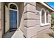 Inviting front entrance with a stylish blue door and decorative sidelights, offering a warm welcome to visitors at 10385 Kern Ridge St, Las Vegas, NV 89178